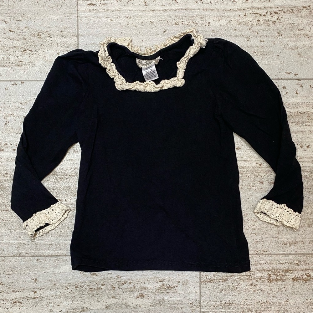 Sado girl’s black shirt w/beige‎ details.